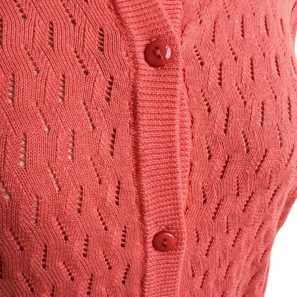 Coral openwork knit detail