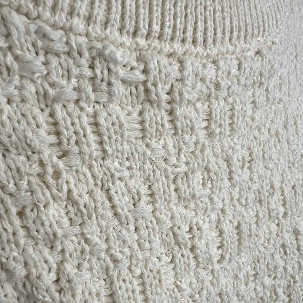 Cream textured knit detail