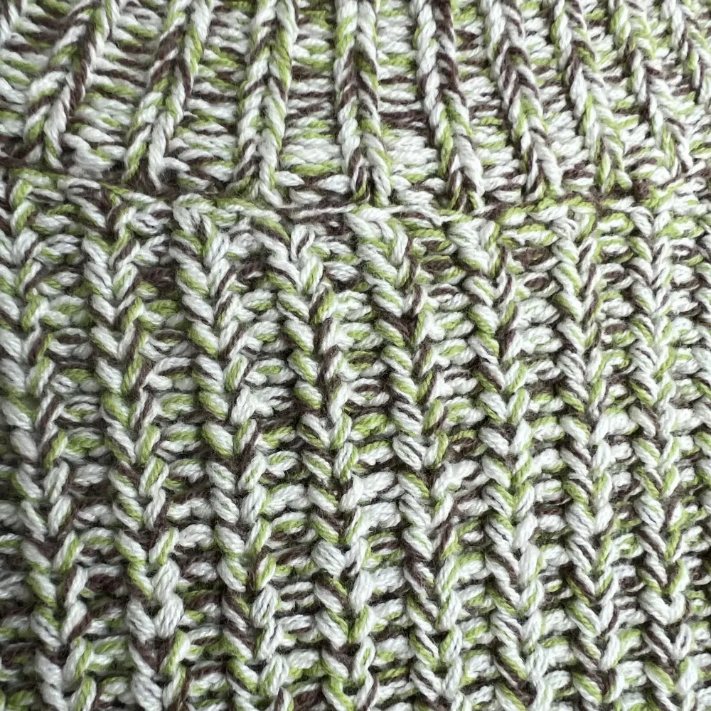 Green melange knit texture detail