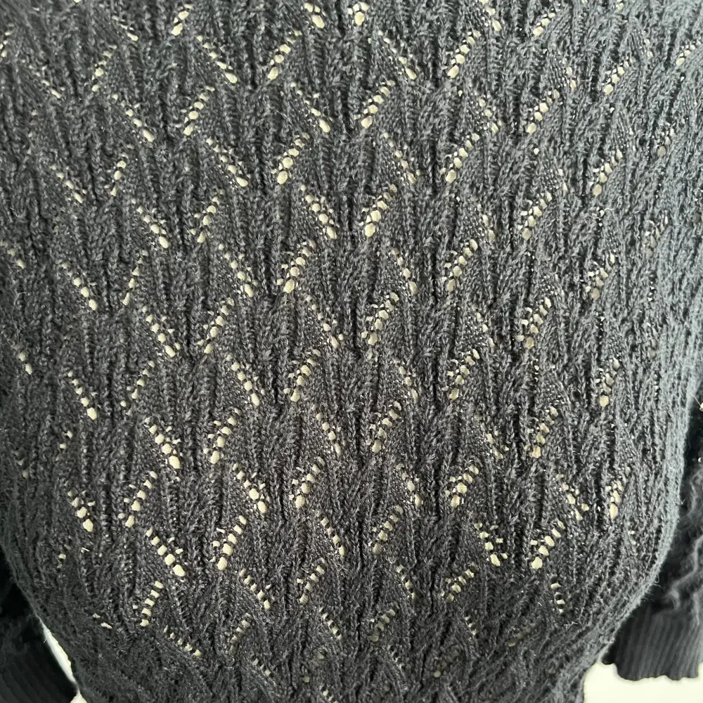 Grey textured knit fabric detail